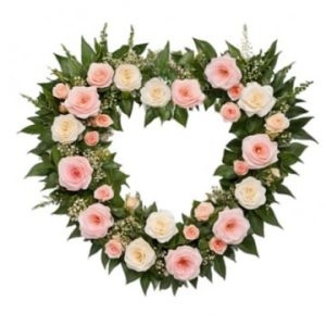 Sött, öppet begravningshjärta, med rosor och prärierosor i rosa och vitt. Gröna blad som bas. Välj mellan olika storlekar hos Florister i Sverige.